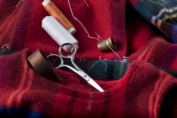 view of a tailored suit from a tailor in his studio. dress with basting child