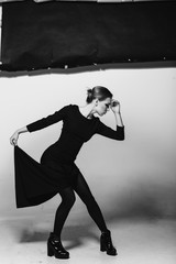 Charismatic woman,dramatic poses, black and white photo, studio