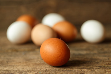Chicken eggs on a wooden rustic background
