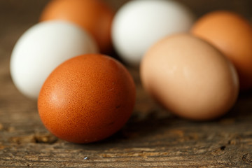 Chicken eggs on a wooden rustic background