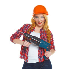 Female construction worker in a helmet with a perforator