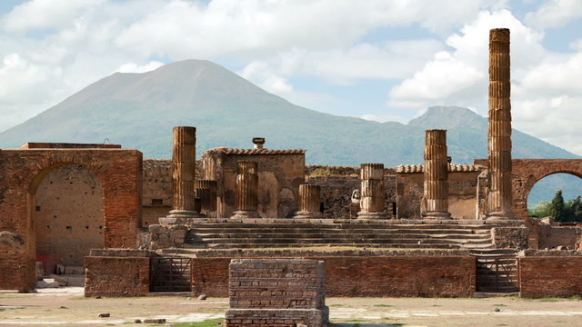 Timelapse of the ruins of Pompei with volcano Vesuvius at back in Italy