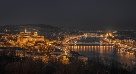 Fototapeta na wymiar Panoramic View of Budapest with Street Lights and the Danube River at Night as Seen from Gellert Hill Lookout Point