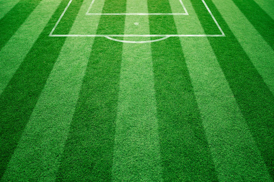 Conceptual football field with soccer goal lines background. Empty soccer field details on soccer field ground. 