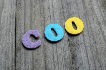 COO (Chief Operating Officer) acronym on wooden background