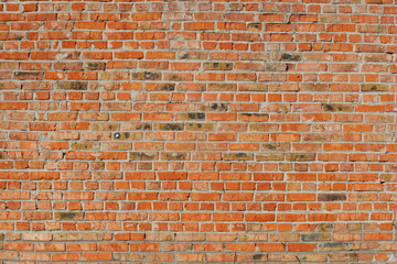 old red brick wall close up.