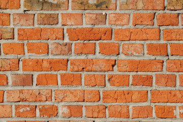 old red brick wall close up.