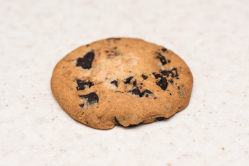 Cookie with chocolate crumbs on the kitchen table