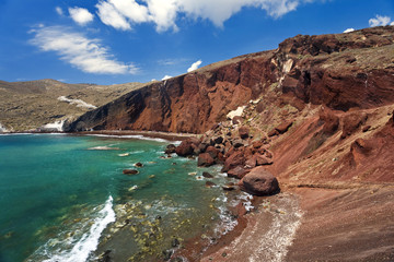 Fototapeta na wymiar Greece. Cyclades Islands - Santorini (Thira). Red Beach - one of the most famous beaches of island known for unique color of the sand and surrounding cliffs
