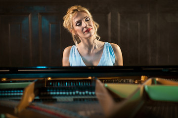 Fototapeta na wymiar beautiful woman musician piano music playing