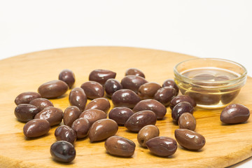 Olive olive oil on a wooden board, isolated