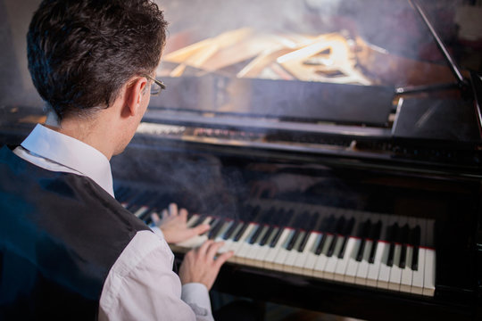 musician playing the grand piano
