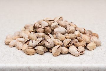 Dried pistachio nuts on the kitchen table