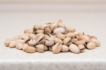Dried pistachio nuts on the kitchen table