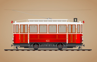 Traditional red tram on tre rail side view