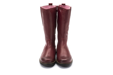 red leather childrens boot on a white background