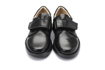 Boys black school shoe on a white background
