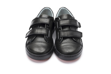 Boys black school shoes on a white background