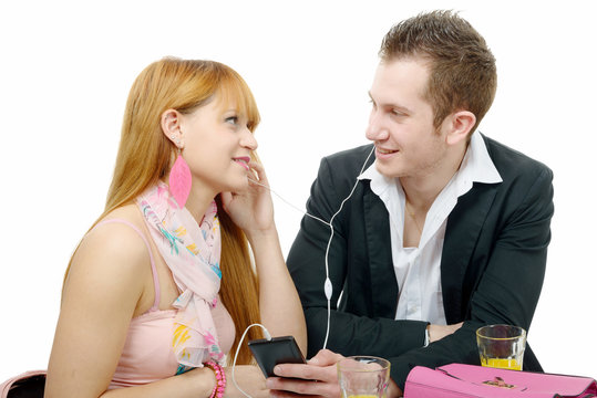 young couple listening to music with smarphone