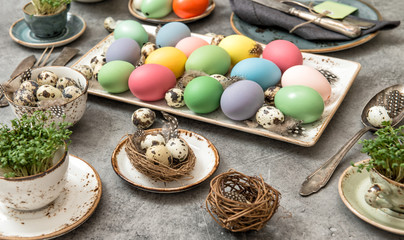 Easter table decoration colored eggs vintage cutlery