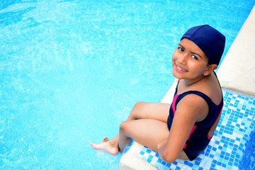 Latinamerican girl in the swimming pool.
