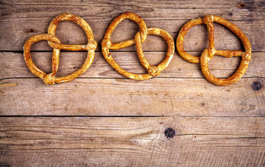 Homemade pastries. Pretzel on wooden background. Food