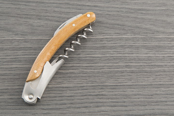 wine opener on wooden table