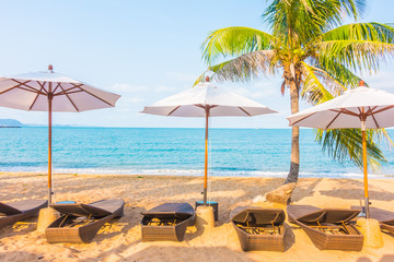 Umbrella and chair on the tropical beautiful beach