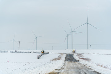 Fototapeta na wymiar Windmill on the field in winter