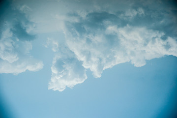 Clouds in the sky. Beautiful vintage photo with a vignette. Can be used as abstract background for different design projects.