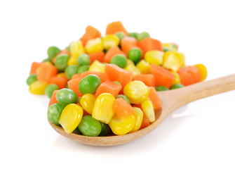 Mix of vegetable containing carrots, peas, and corn on white bac