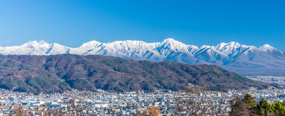 Panorama cityscapoe and mountain landscape view of Suwa city. The city is  on the shore of Lake...
