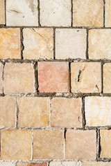 Background of ancient marble stone tiles in wall