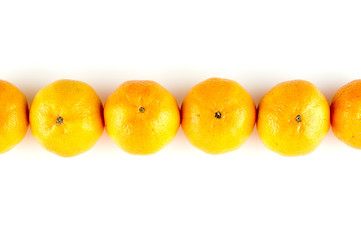 Line of oranges isolated on white with copyspace