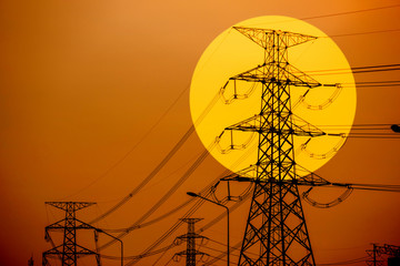 high voltage post.High-voltage tower sunset sky background.