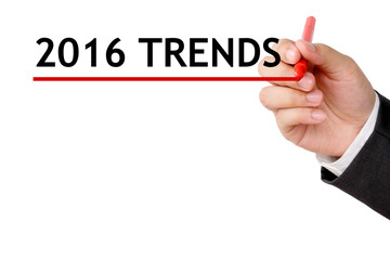 Hand holding pen and 2016 trends background