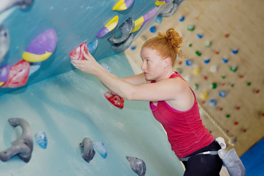 Woman Indoor Free Climbing. Indoor Rock Climbing