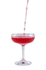 Red liquid dropping into the glass