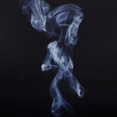 White smoke on black background