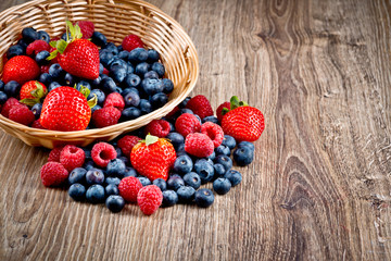 Berries on wooden background