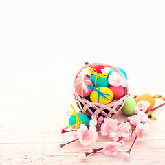 Colorful easter eggs and branch with flowers. Top view, square. Poster, mock up for design. Selective focus