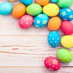 Obraz na płótnie Canvas Colorful easter eggs and branch with flowers. Top view, square. Poster, mock up for design. Selective focus