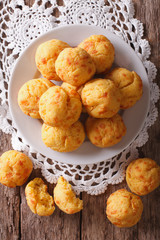 French pastries gougere with cheese on the table. Vertical top view
