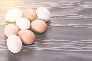 Egg on the fabric background with vintage filter effect.