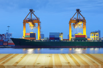 Gantry crane loading and unloading cargo container  from cargo ship at port to show global...