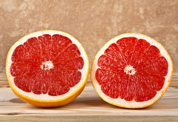 Grapefruit segments on wooden background