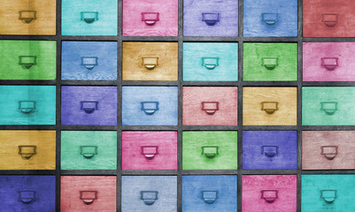 Apothecary wood chest with colored drawers