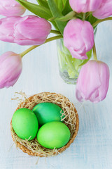 Easter composition with eggs and tulips