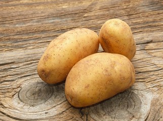 potatoes on wooden background