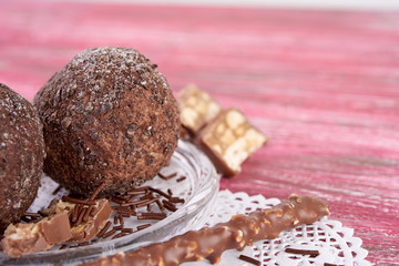 Cupcake with chocolate on wooden background
